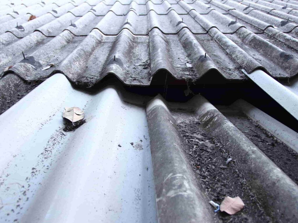 Gap in corrugated roofing sheets requiring roof leak detection inspection